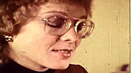 Retro video as British secretary with big tits and hairy pussy takes charge