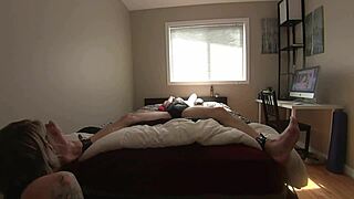 Submissive partner's feet and cock are dominated by their mature woman