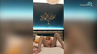 Passionate milf fondles wet pussy on camera.