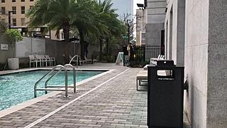 This milf is rocking a sheer bikini at the public pool, so sexy!