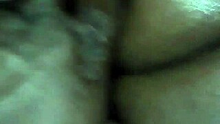 rubbing body oil on a black milf during massage