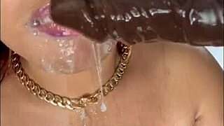 Mature black woman goes for deepthroat on sloppy dildos