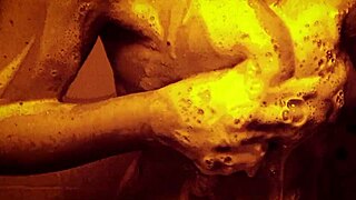 Tantalizingly slow motion close ups in a steamy shower scene