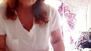 She puts the lotion on her sexy skin