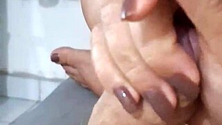 Asian MILF gives young boy a sloppy blowjob and massage
