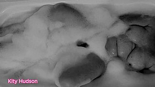 KITY HUDSON ENJOYS BATH WITH TOY