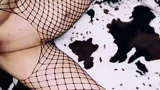 A wife in an erotic fishnet bodysuit beautifully spreads her legs