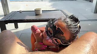 Latina milf gives oiled blowjob by the pool in pov