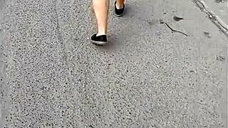 A mature woman in a skirt enjoys the surprise she was given