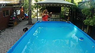 melissa the mermaid swims in the pool with brown eyes and tattoo