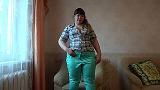The busty brunette caresses her pussy and her clitoris with her fingers