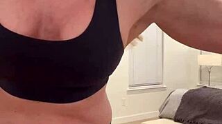 athletic milf wife flexes muscles in homemade solo