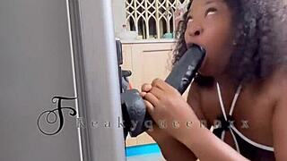 hot milf camgirl rides 14-inch dildo on fridge in kitchen video