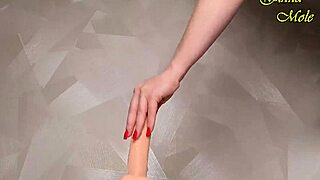 This hot milf in red fishnets rides her dildo like a pro!