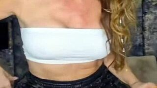 Pierced woman in pantyhose with milf allure.