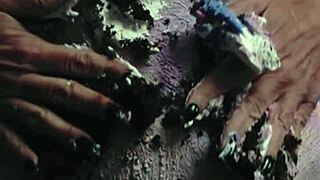 Messy birthday cake girl plays with food on natural tits