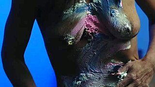 Messy birthday cake girl plays with food on natural tits