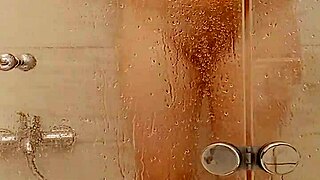 She caresses herself sensually in the warm bath.