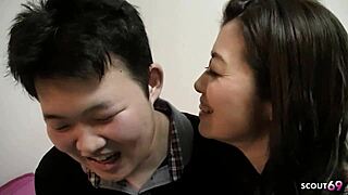 Watch this Japanese cougar get tricked into amateur MMF threesome with boy and old men!