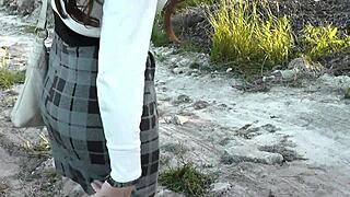 Pretty brunette milf jerks dick in public panties