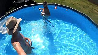 Pregnant milf enjoys pool time with neighbors watching