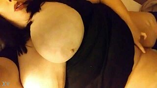 Sexy milf with big boobs masturbates in bed.