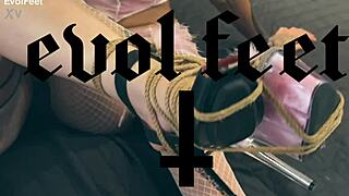 blonde goddess dominates submissive slave with bondage and foot worship