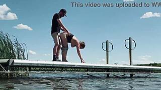 Couple risks getting caught fucking outdoors at the lake. They expose big natural tits and perform blowjob for anyone to watch.