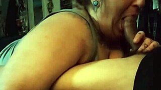 Redhead milf starts sucking huge cock before intense titty fuck session unfolds