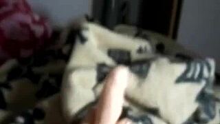 In a dominant scene, the milf gives an intense footjob while teasing her pussy.