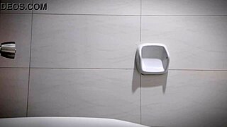 The sexy horny office girl masturbates in the bathroom, revealing her big tits and tight pussy close up