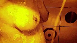 Wow, check out this sexy slow mo shower with horny milf massaging her wet tits and nipples!