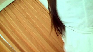 Black-haired beautiful Asian Nagisa Fukushima visits guy's house, gets fingered in fishnets and takes anal on bed