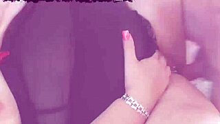 Alisha Rydes lies naked on bed for mature solo masturbation with shaved pussy.