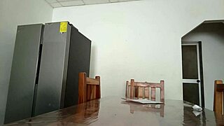 Maintenance Man Checks Refrigerator While Housewife Shows Vagina On Table