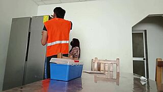 Maintenance Man Checks Refrigerator While Housewife Shows Vagina On Table