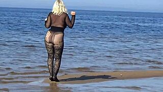 Black style blonde milf flashing big natural tits and big ass on the beach in pantyhose and heels
