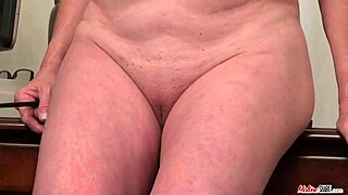 Mature Pornstar Undresses in Office for Solo Snatch Play