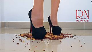 Brunette curvy femdom in boots and lingerie destroys cornflakes with high heels on dorm floor. Party maid scene with gaping and submissive naked action.