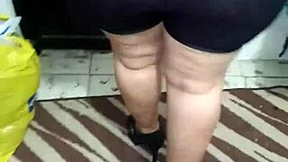 señora with big ass in shiny spandex leggings shows off her curves