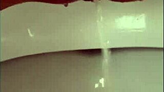 Close-up shows my pissing shaved pussy with pierced clit in outdoor solo moment.