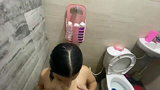 Hermanastra with natural tits masturbates her stepbrother's big cock in the shower