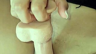 i'm a latina milf playing with my big tits and squirting while using a huge dildo to get that creamy milk finish