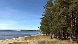 Blonde Milf struts in fishnet bodystocking heels stockings teasing her big natural tits and pussy