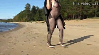 Blonde Milf struts in fishnet bodystocking heels stockings teasing her big natural tits and pussy