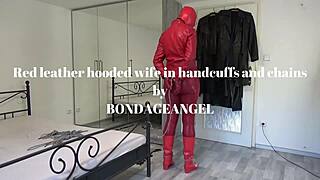 red leather hooded milf wife locked in chains and handcuffs for bondage play